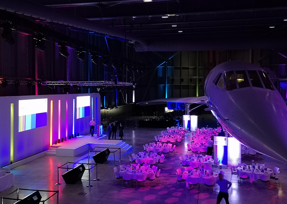 A view inside Bristol Aerospace with the last ever Concorde position on the right hand side and a full stage set on the left with multicoloured lights.