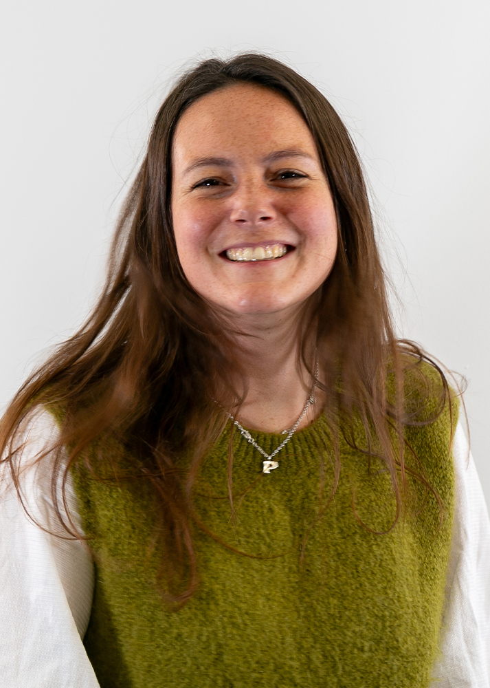 Phoebe Currie, Sustainability and Social Values Manager at SLX with a huge smile on her face.